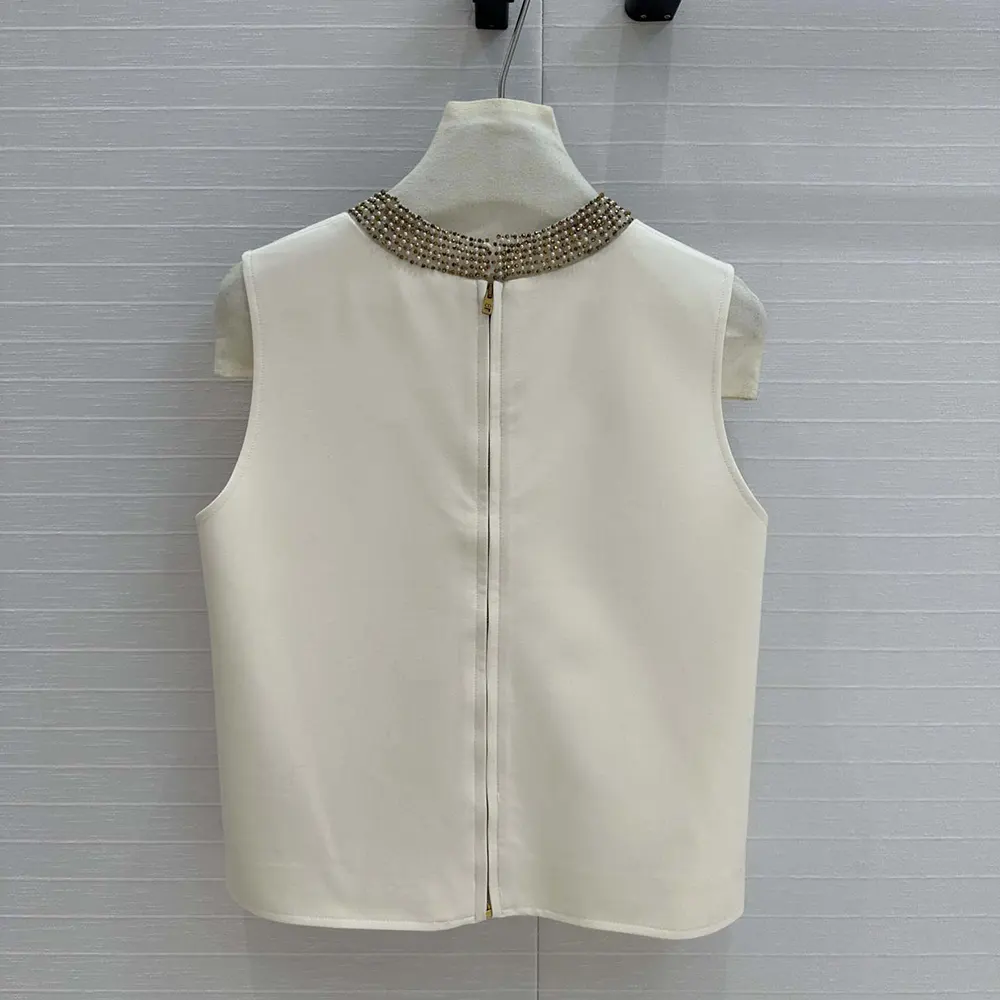 Side profile showing drape of Dior Women Embroidered Top White Wool and Silk