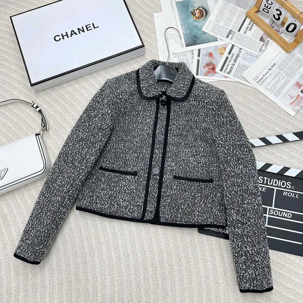 Close-up of textured knit and silver buttons on Dior Women Jacket