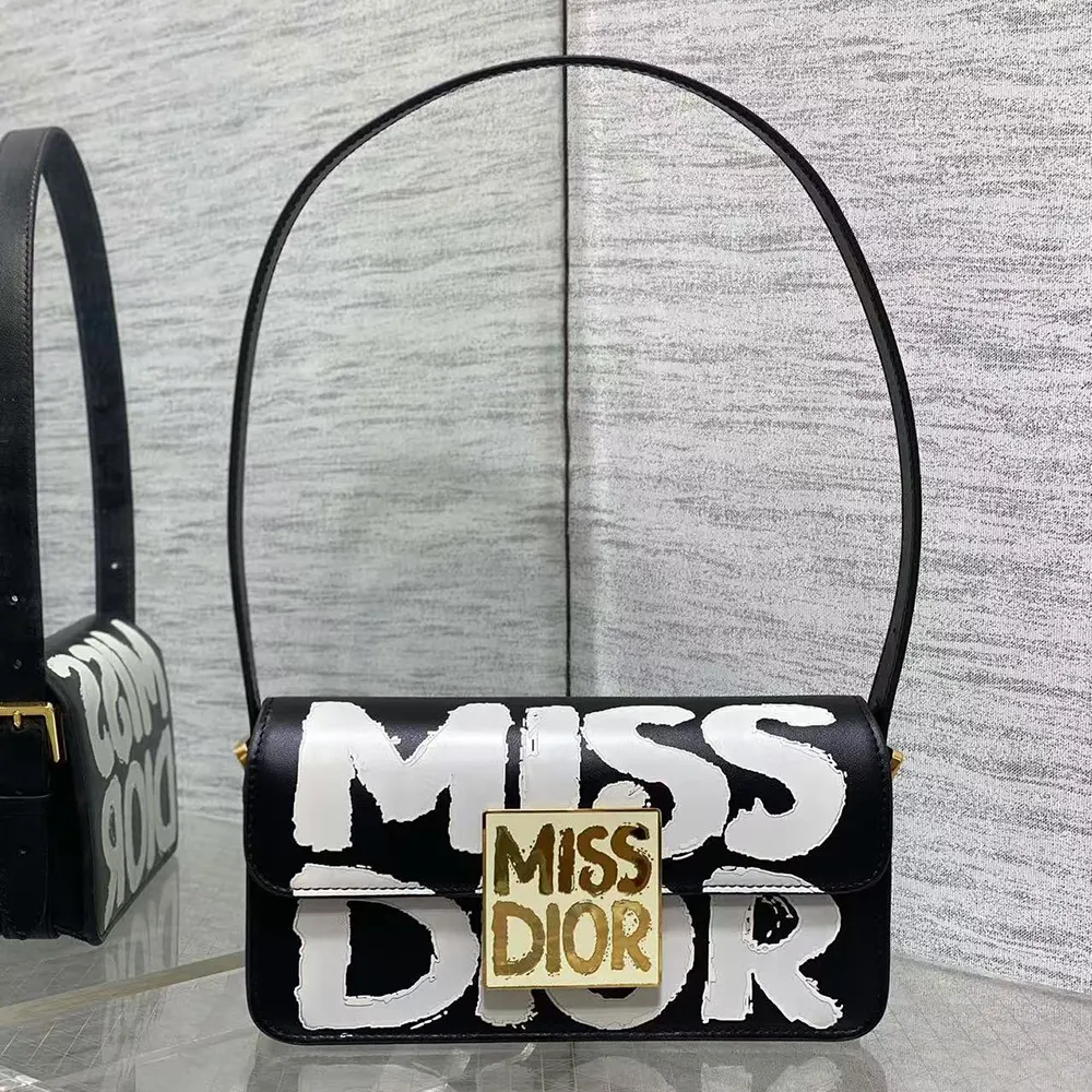 Close-up of silver-tone hardware on Dior Women Miss Dior Flap Bag