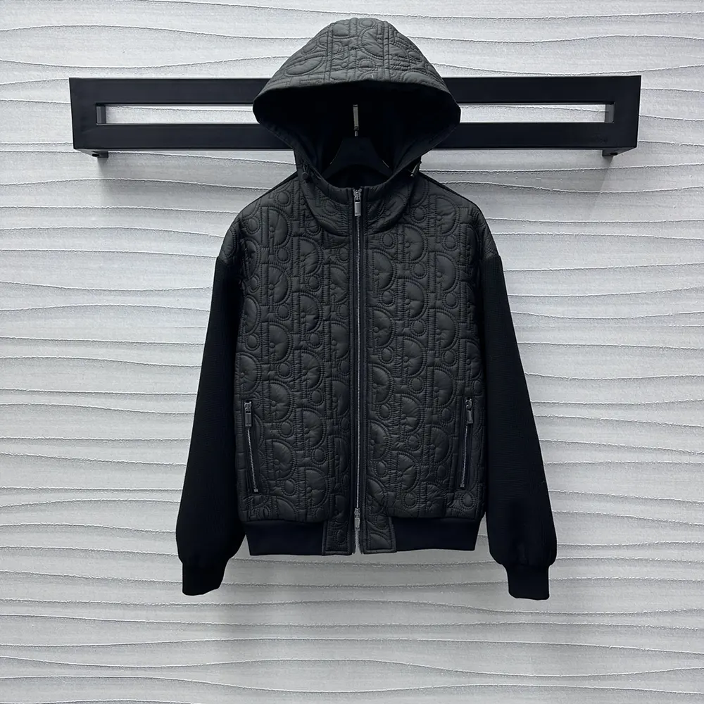 Close-up on Dior signature oblique motif hardware and knit texture