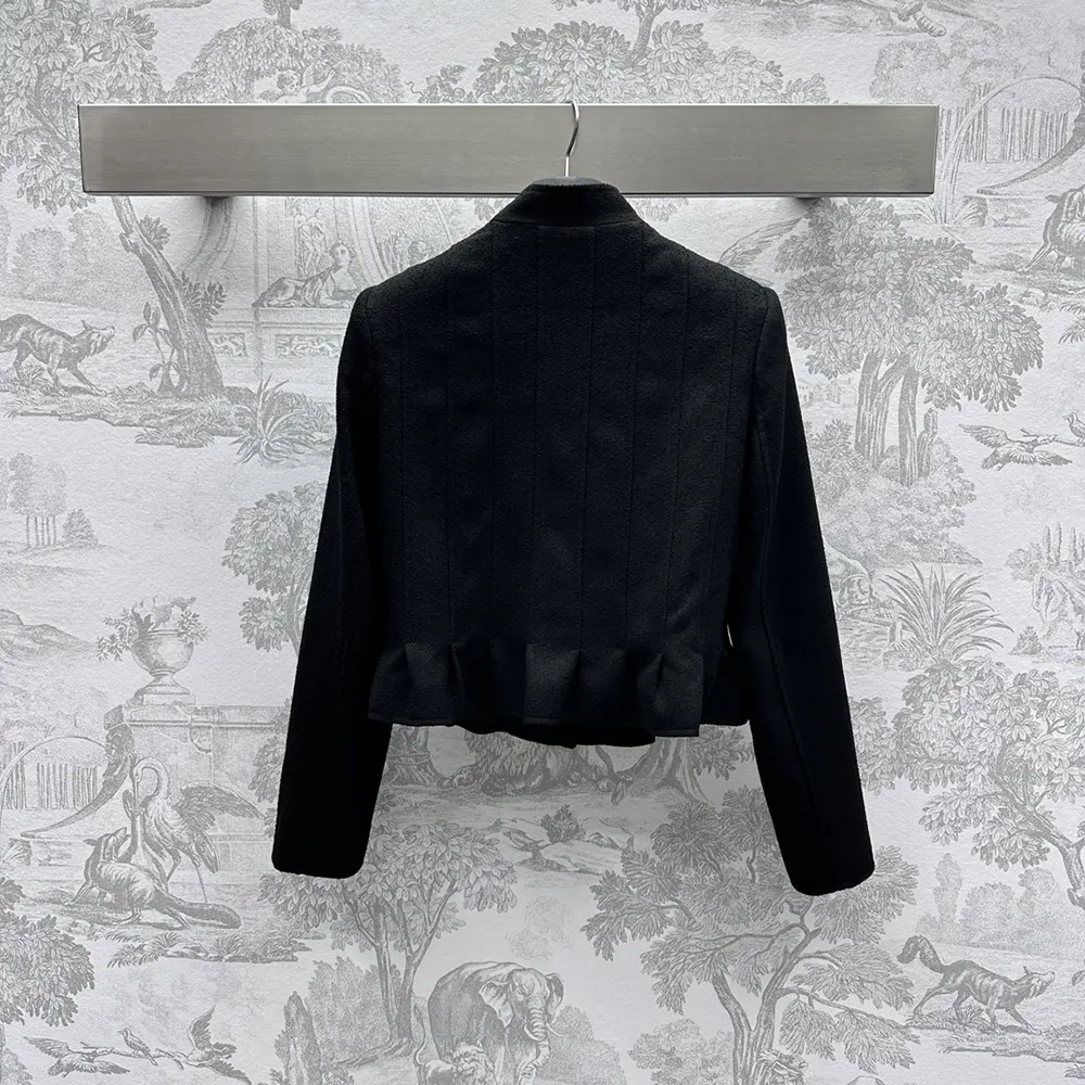Side profile showing tailored fit of Dior Women Peplum Jacket in black