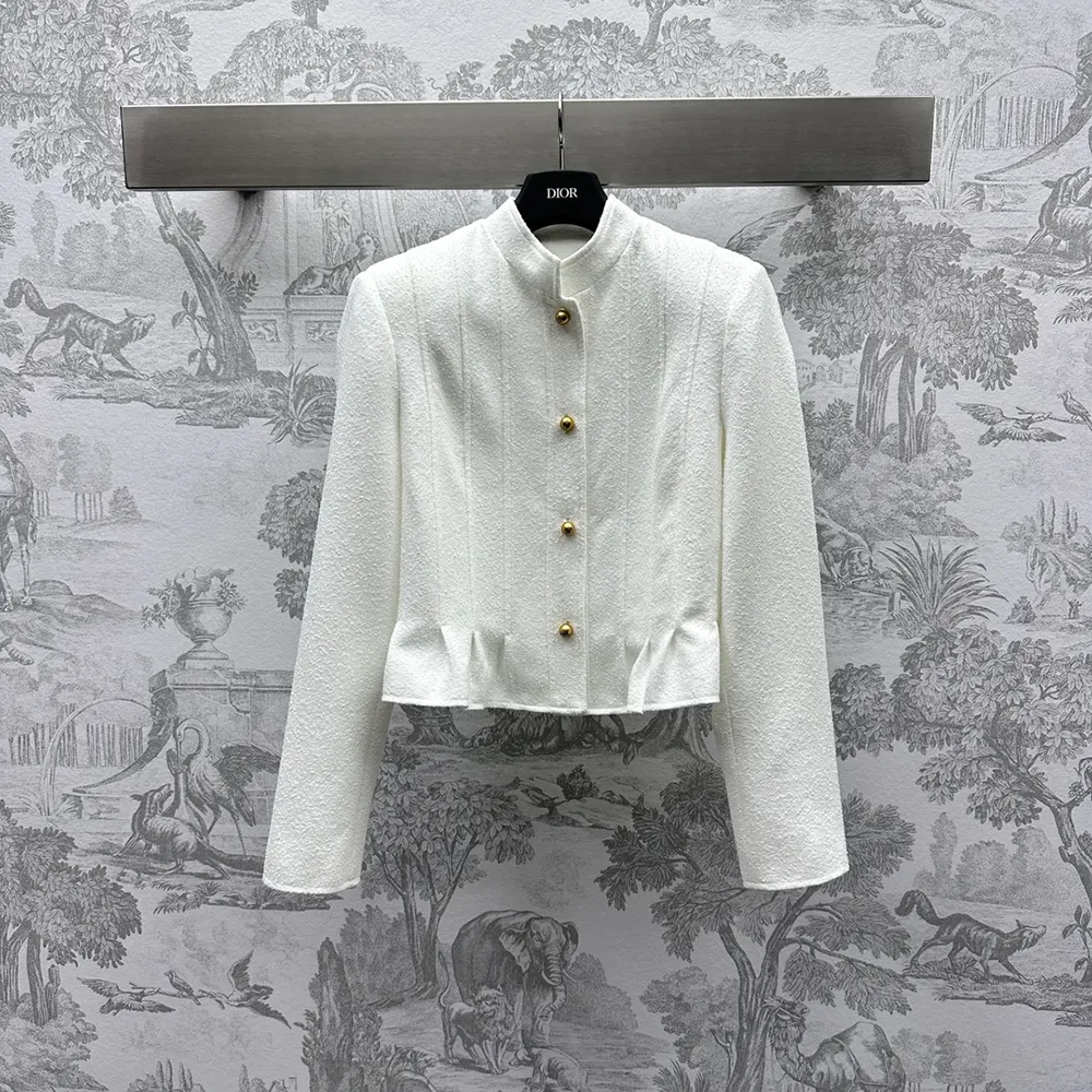 Close-up of textured bouclé fabric on Dior Women Peplum Jacket