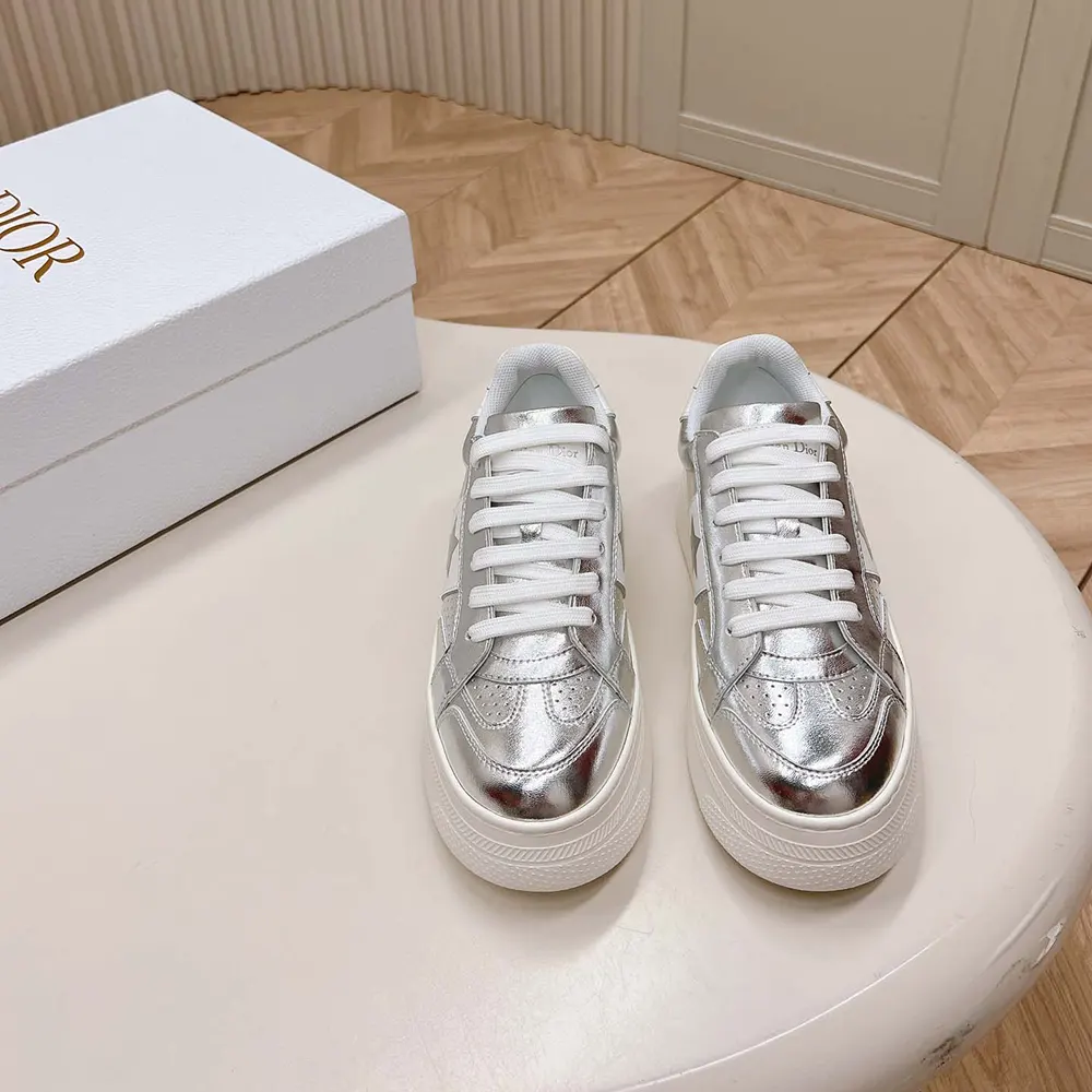 Close-up on silver-tone star hardware detail on Dior Women Star Platform Sneaker