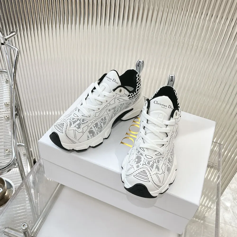 Close-up detail of Dior Oblique print on white mesh sneaker