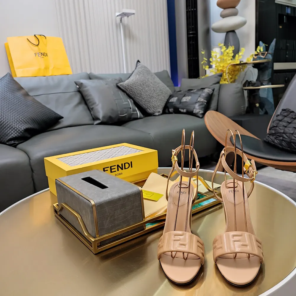 Top angle showing beige nappa leather and buckle on Fendi Women Delfina sandals