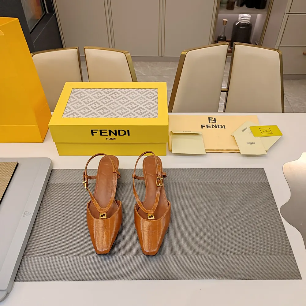 Close-up on gold FF logo hardware on Fendi slingbacks