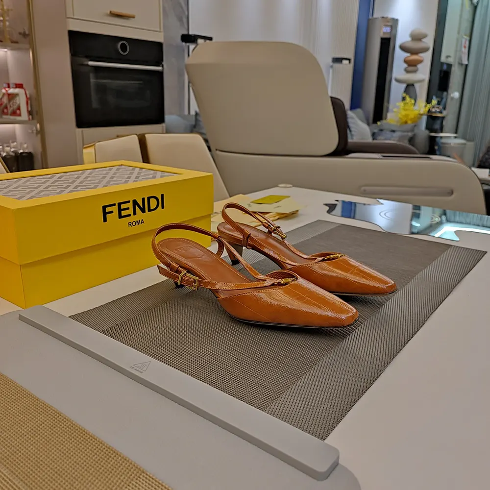 Back angle showing adjustable strap on Fendi beige slingbacks