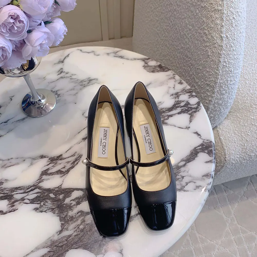 Close-up on patent leather detail of Jimmy Choo Women Elisa 45 pumps