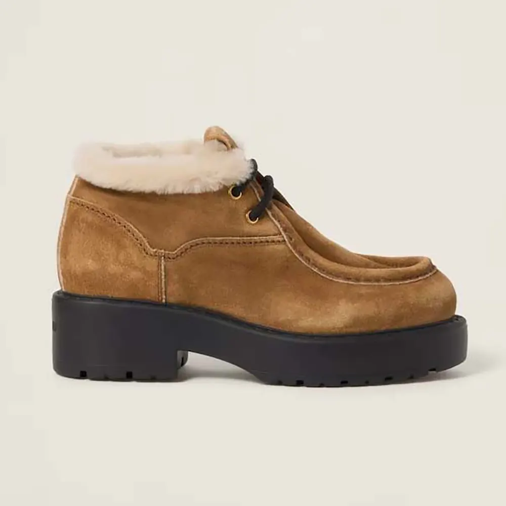 Side view of Miu Miu Women Faded Suede Booties in brown