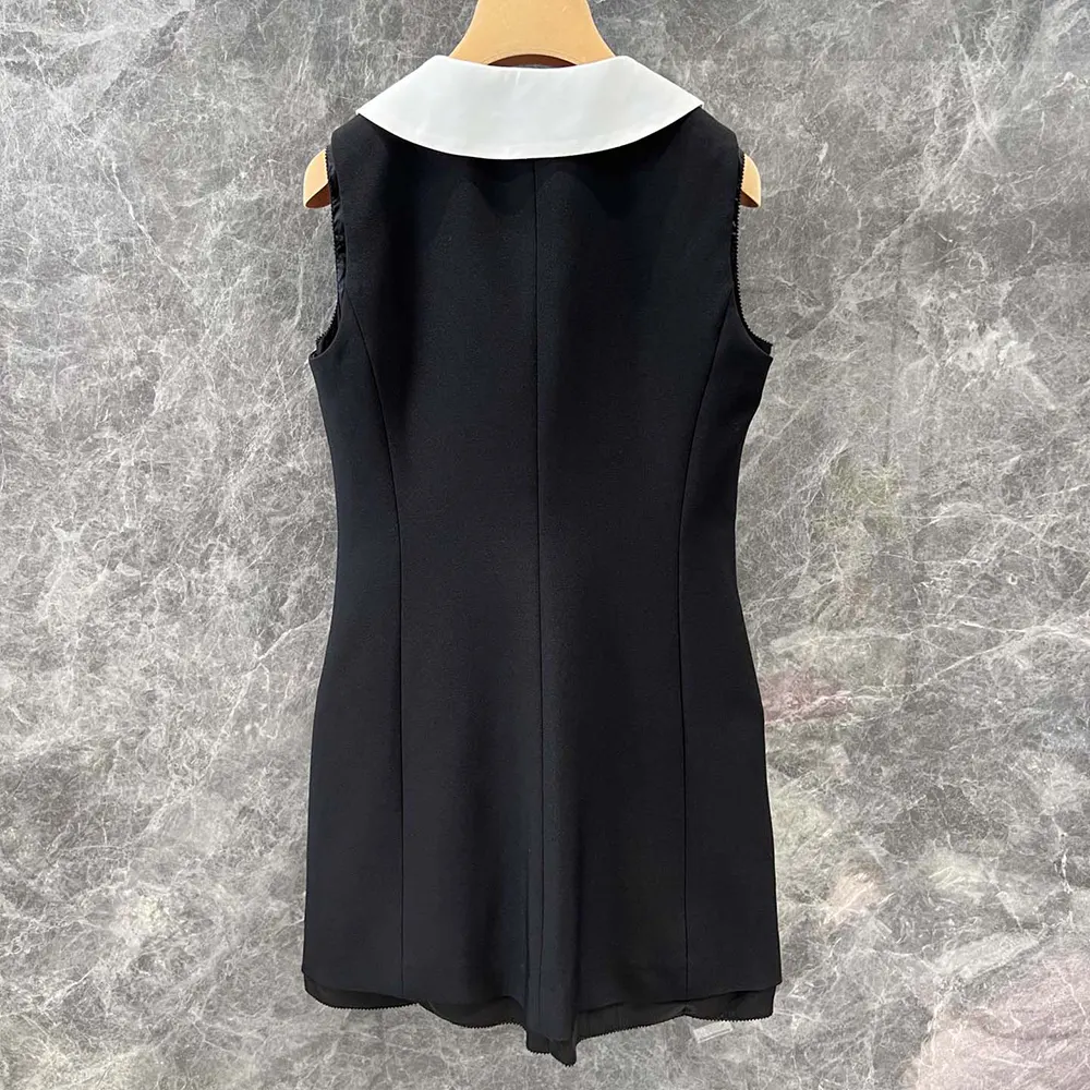Back detail with hidden zipper on Miu Miu Grain De Poudre Wool Mini-dress