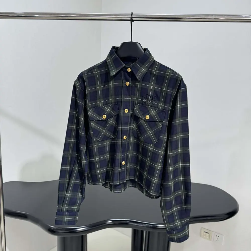 Close-up of embroidered logo on navy Miu Miu Women Plaid Shirt