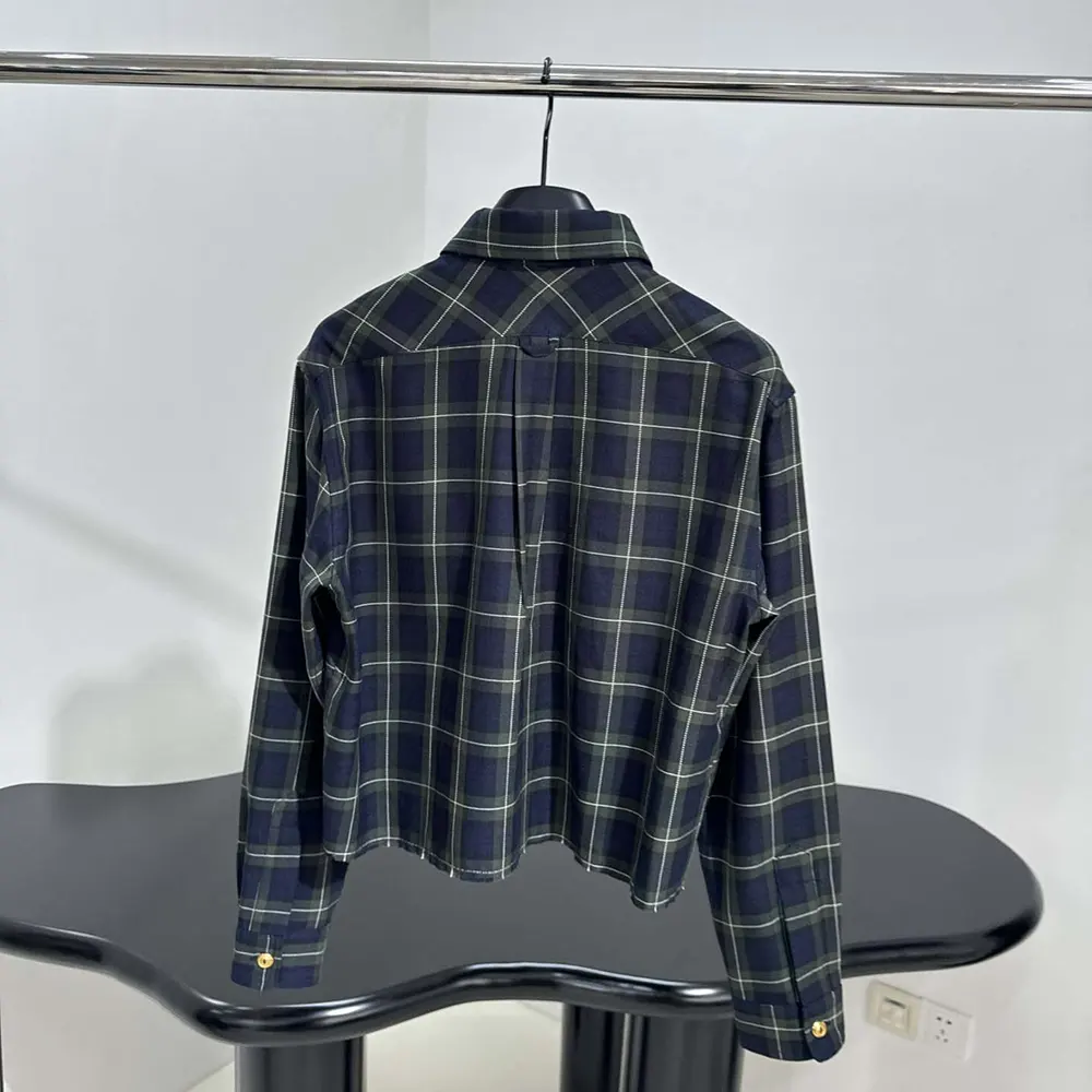 Side angle showing button closure on Miu Miu Women Plaid Shirt with Embroidered logo