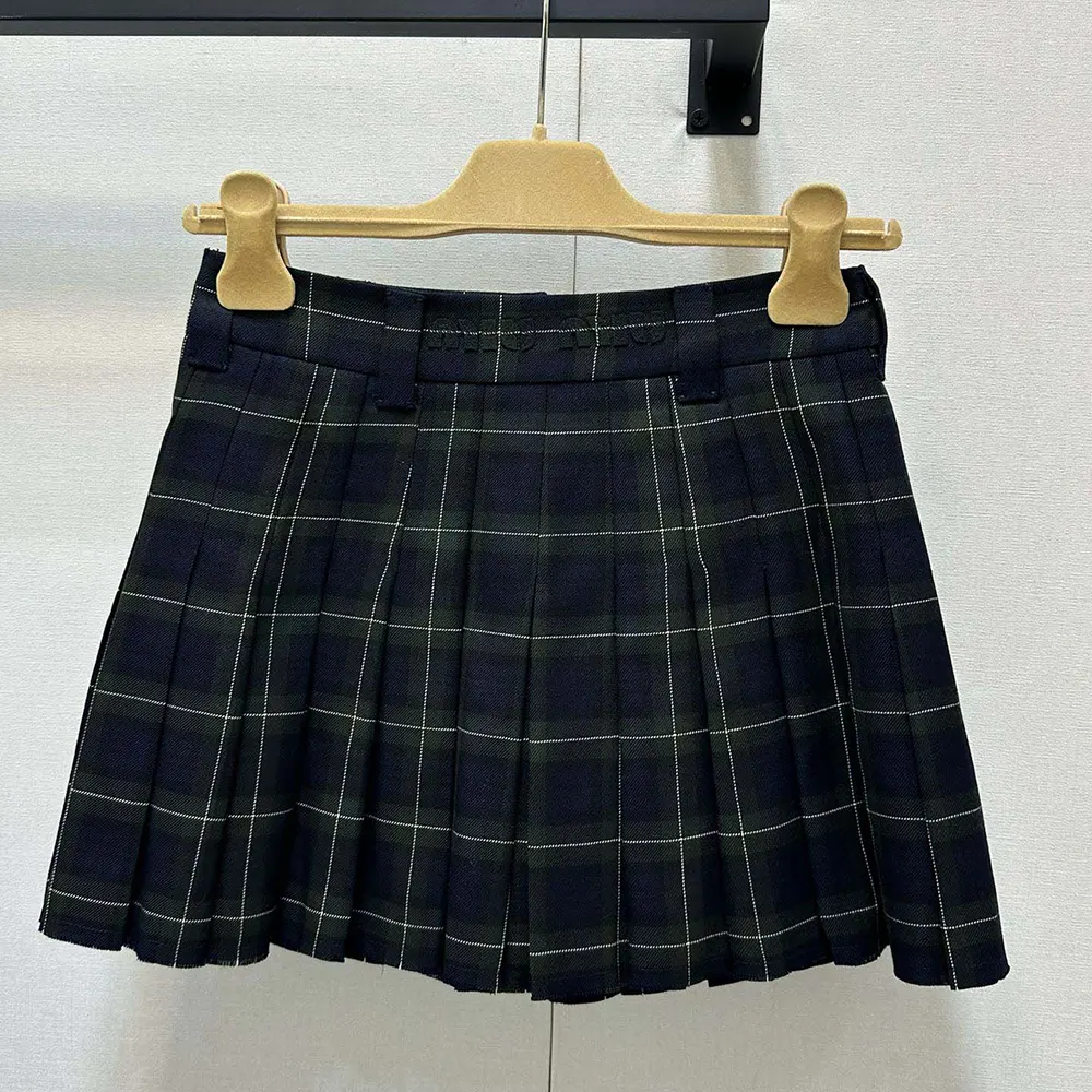 Side angle showing silhouette of Miu Miu Women Pleated Tartan Miniskirt