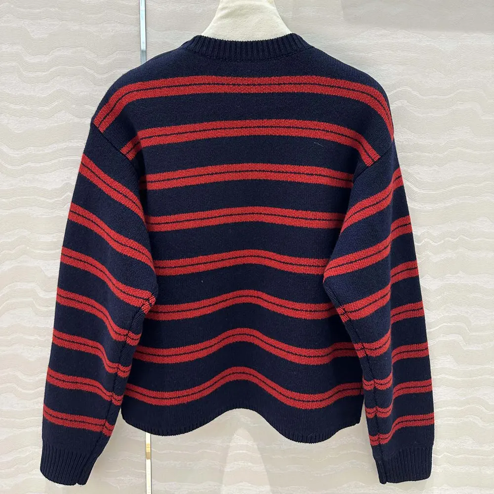 Side angle showing relaxed fit of Miu Miu Women Shetland Wool Crew-neck Sweater