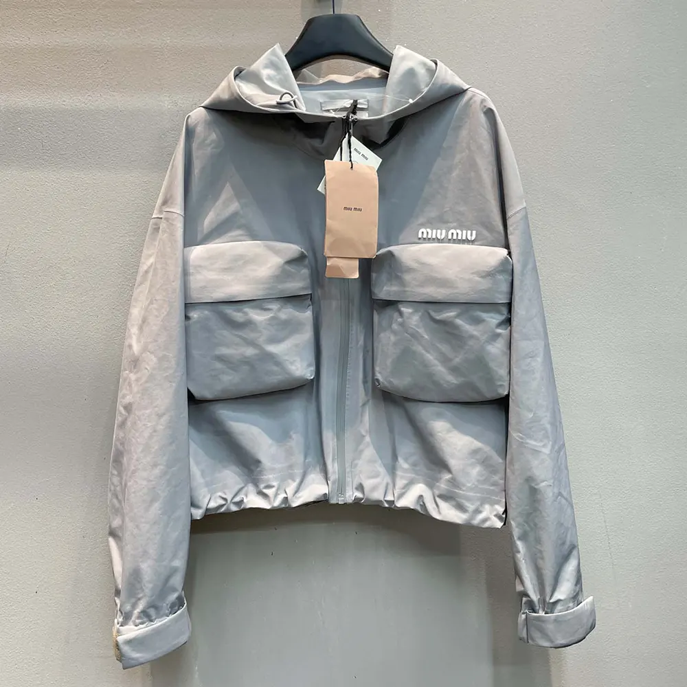 Close-up of zipper and branded hardware on Miu Miu Women Tec Canvas Blouson