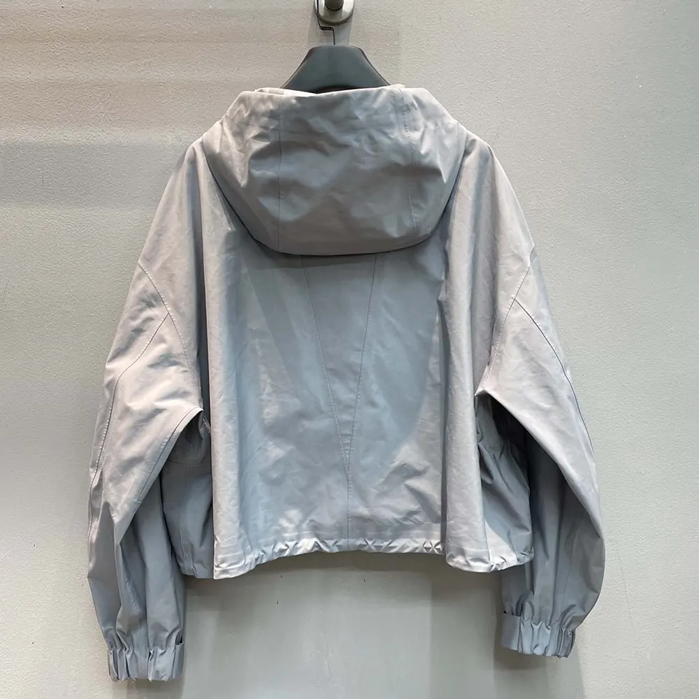 Side profile showcasing silhouette of Miu Miu Women Tec Canvas Blouson