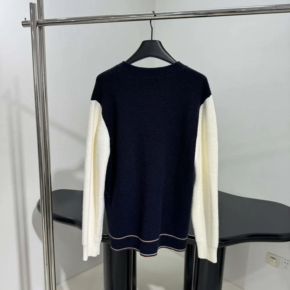 Side angle showing button closure on Miu Miu Wool and Cashmere Cardigan