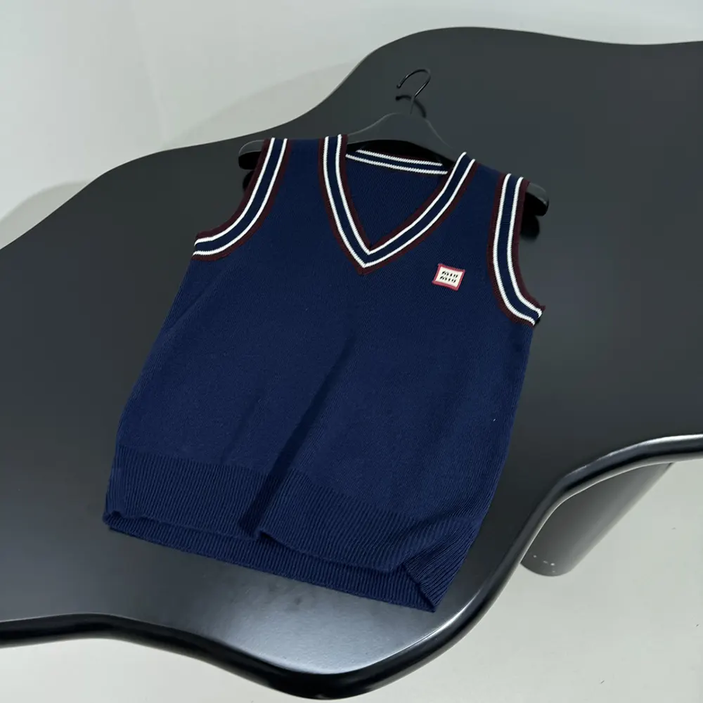 Close-up of knit texture and signature detailing on Miu Miu vest