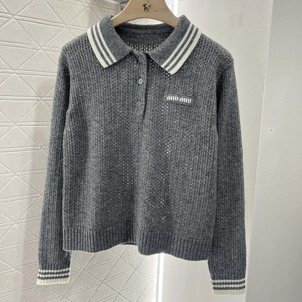 Close-up of Miu Miu Women Wool and Cashmere Polo Sweater collar and buttons
