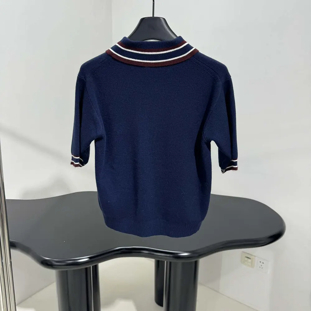 Side profile showing silhouette of Miu Miu Women Wool and Cashmere Polo Sweater