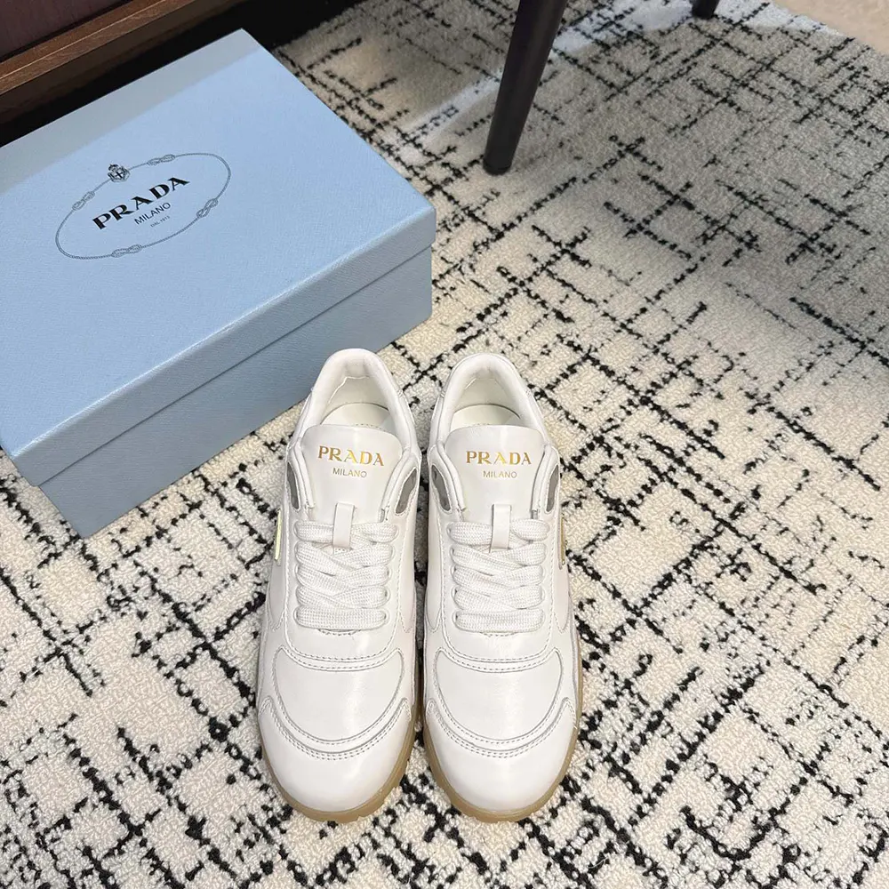 Close-up of white Nappa leather texture on Prada Downtown sneakers
