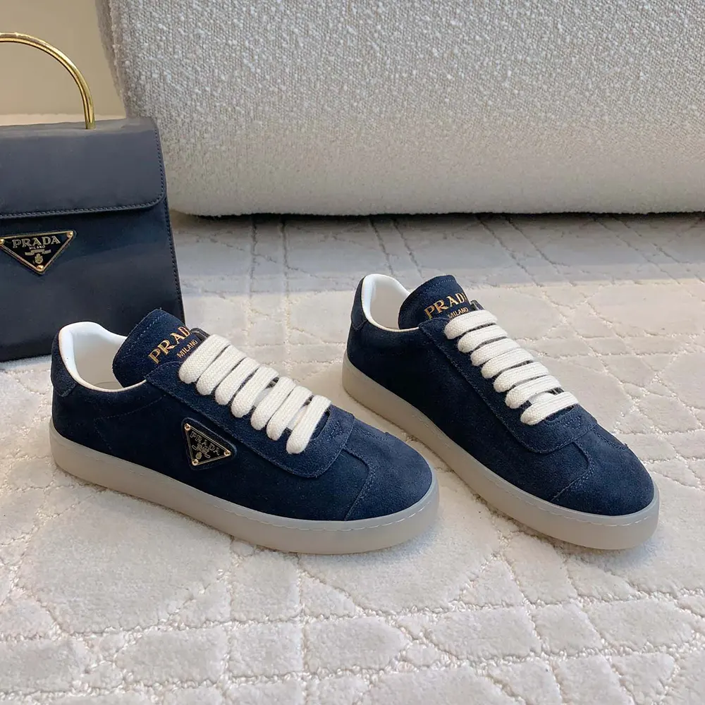 Top-down view showing lace-up closure on Prada Unisex Suede Sneakers