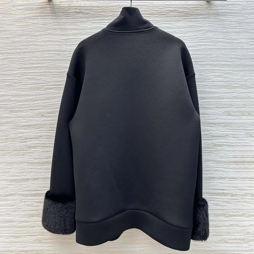 Side angle showcasing silhouette of Prada Women Double Fleece High-neck Blouson