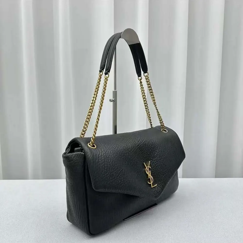 Side profile showing the structured silhouette of the Calypso Large bag