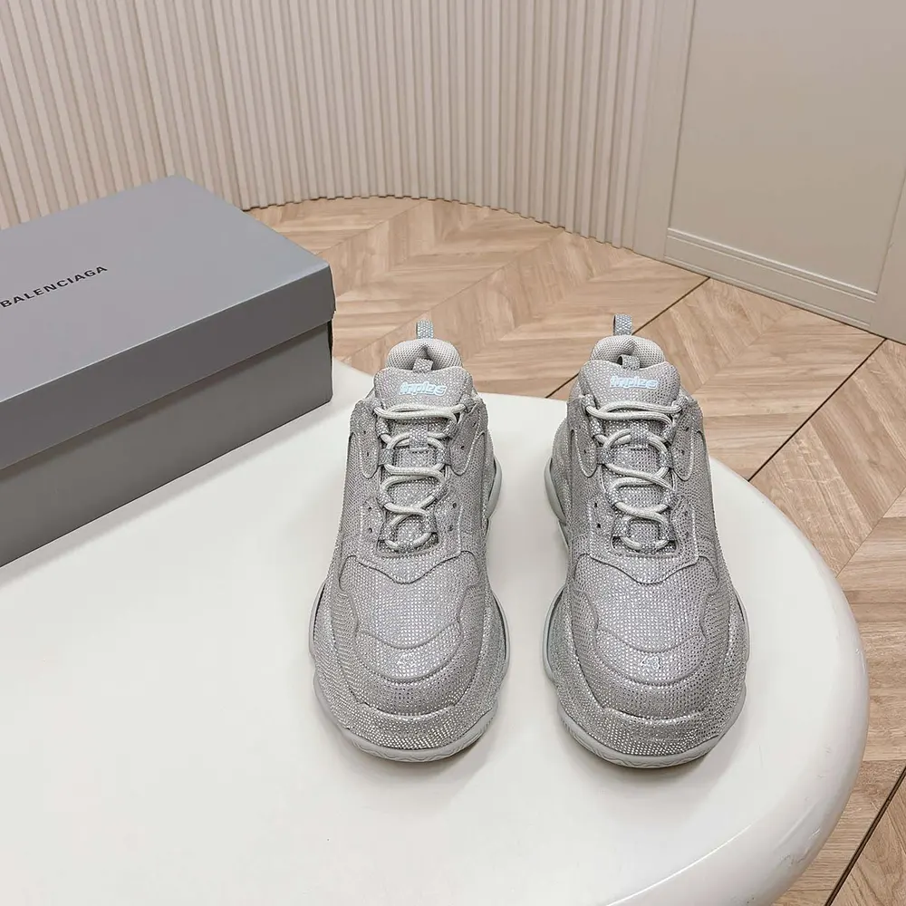 Close-up detail of rhinestone embellishments on Balenciaga Triple S sneaker