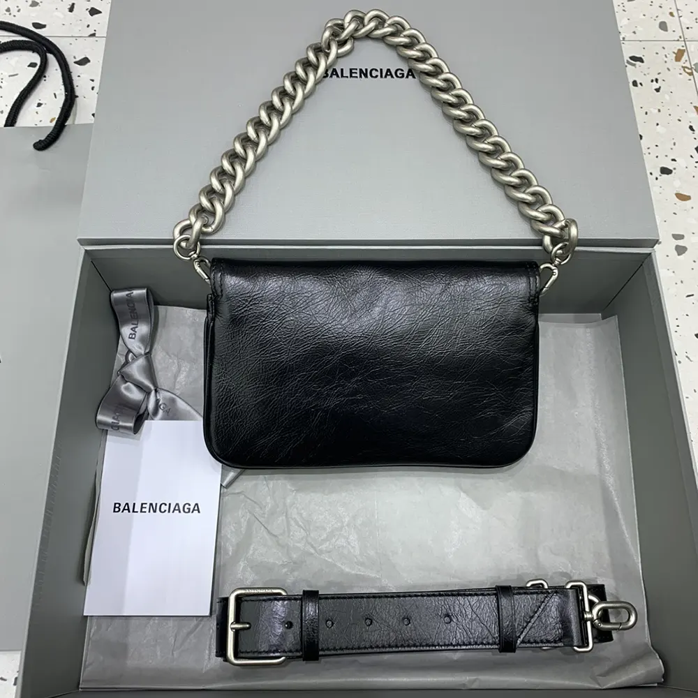 Side angle showing soft silhouette of Balenciaga Women BB Soft Small Flap Bag