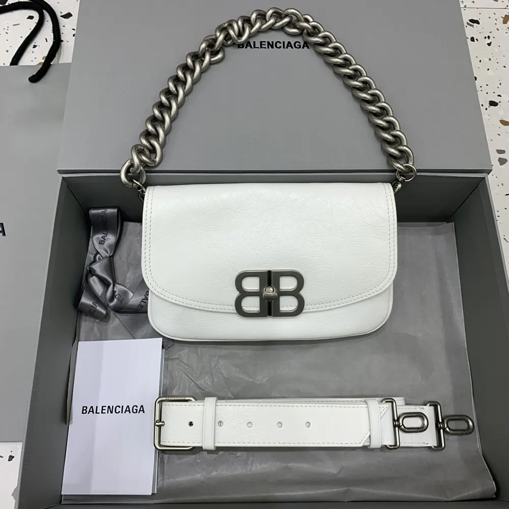 Close-up of silver BB logo clasp on Balenciaga Women BB Soft Small Flap Bag