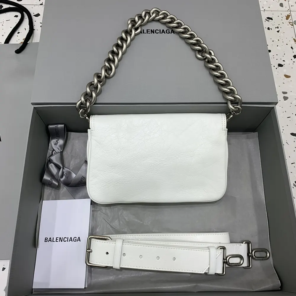 Side angle showing soft silhouette and shoulder strap of Balenciaga Women BB Soft Small Flap Bag
