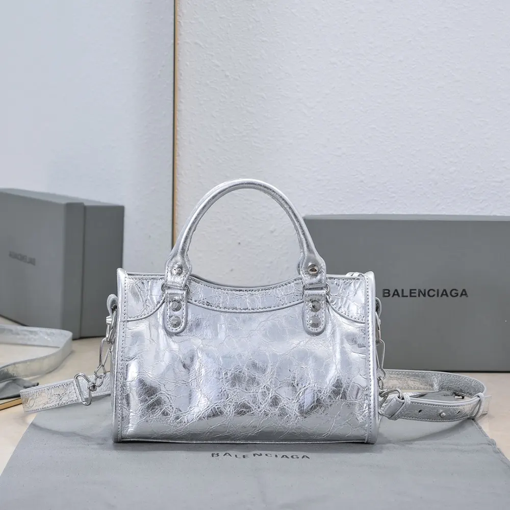 Close-up of silver-tone zip and engraved logo on Balenciaga bag