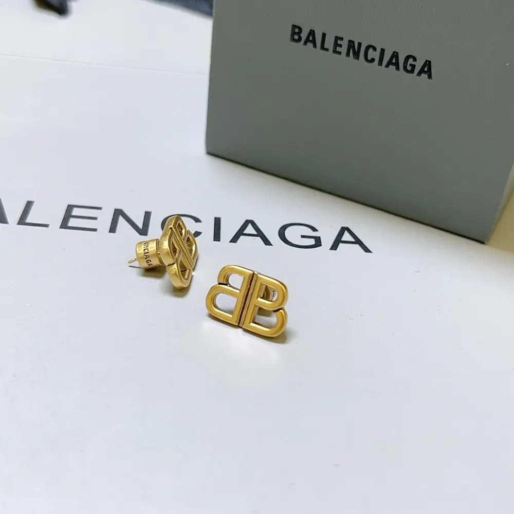 Side profile showcasing the polished finish of Balenciaga Monaco Stud S Earrings