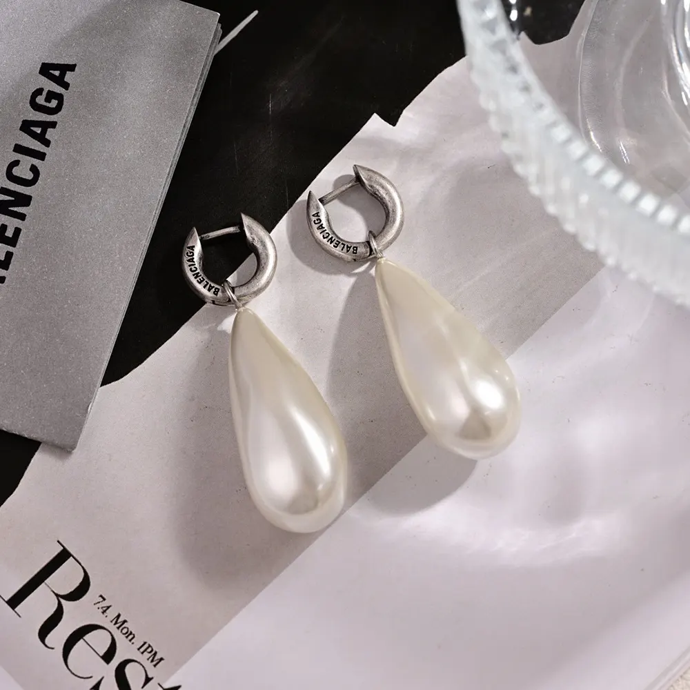 Side angle showing drop length of Balenciaga Women Palazzo Pearl Earrings