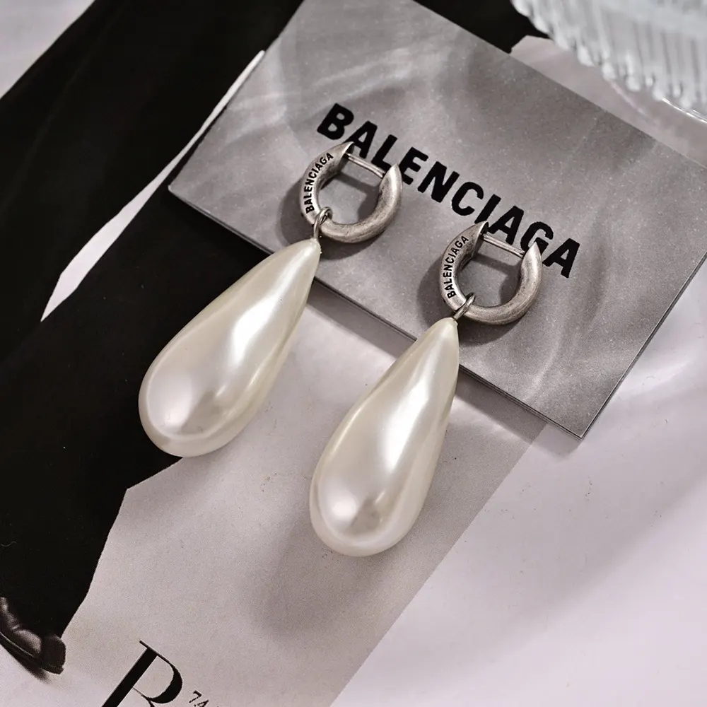 Close-up detail of white pearls on Balenciaga Palazzo Pearl Earrings