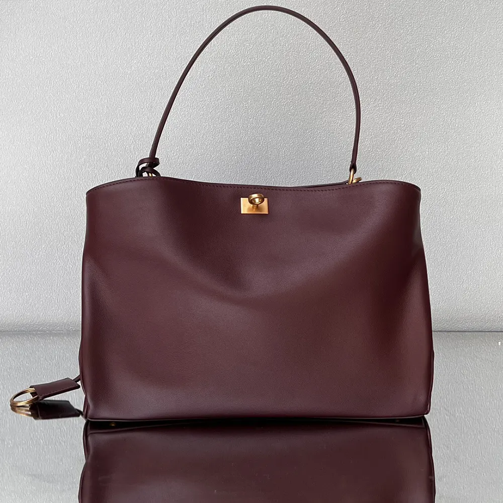 Side profile showing smooth calfskin texture on Balenciaga Women Rodeo Medium Handbag