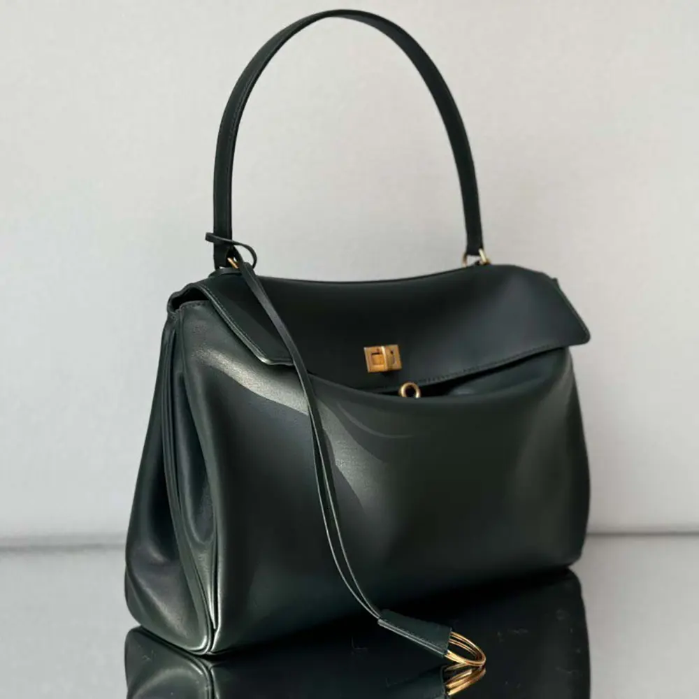 Side angle showing adjustable strap and zip closure on Balenciaga Women Rodeo Medium Handbag