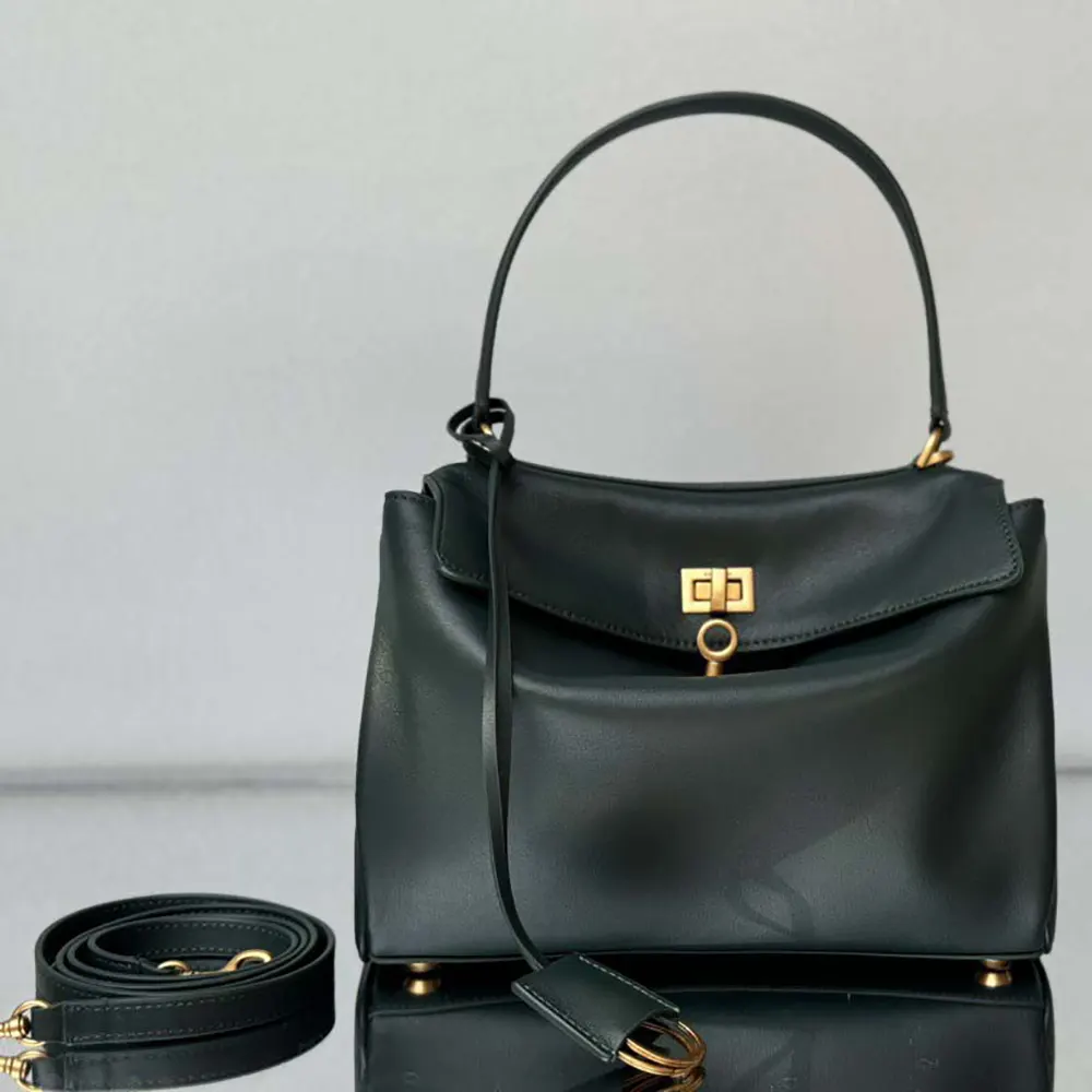Close-up of smooth calfskin texture and silver hardware on Rodeo Mini Handbag