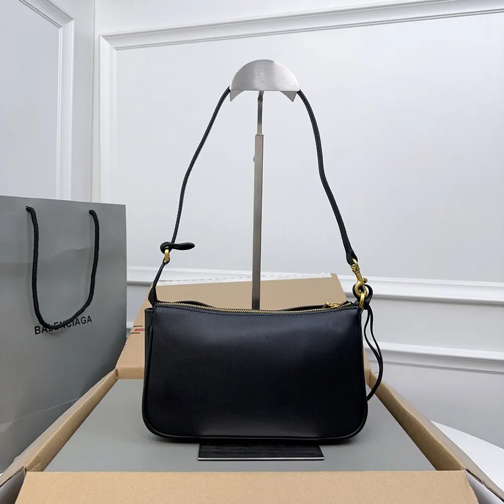 Side profile showing slim silhouette of Balenciaga Women Rodeo Sling Pochette