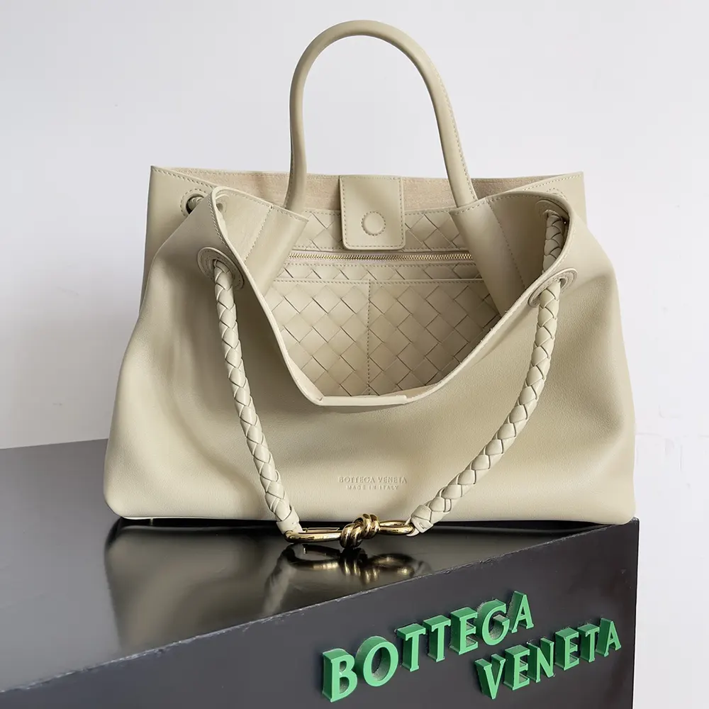 Close-up of brushed gold hardware on Bottega Veneta Women Andiamo bag