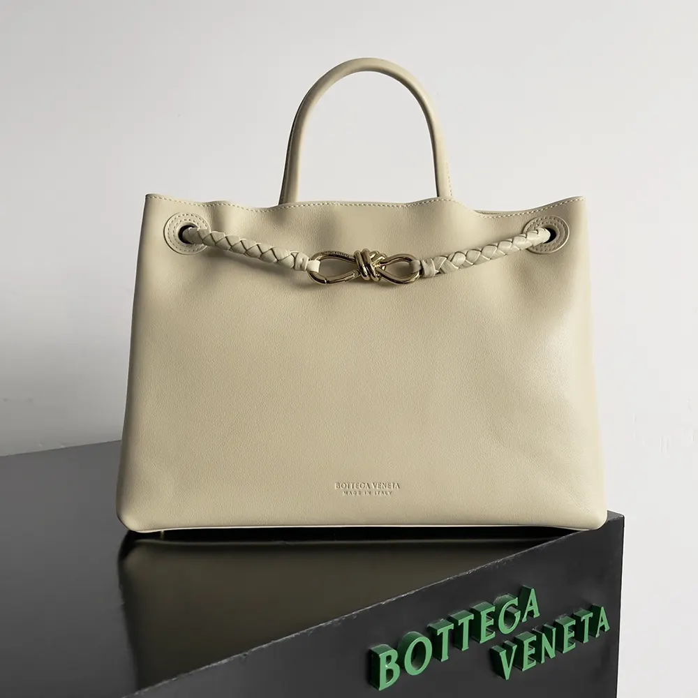 Side angle showing sleek silhouette of Bottega Veneta Women Andiamo shoulder bag