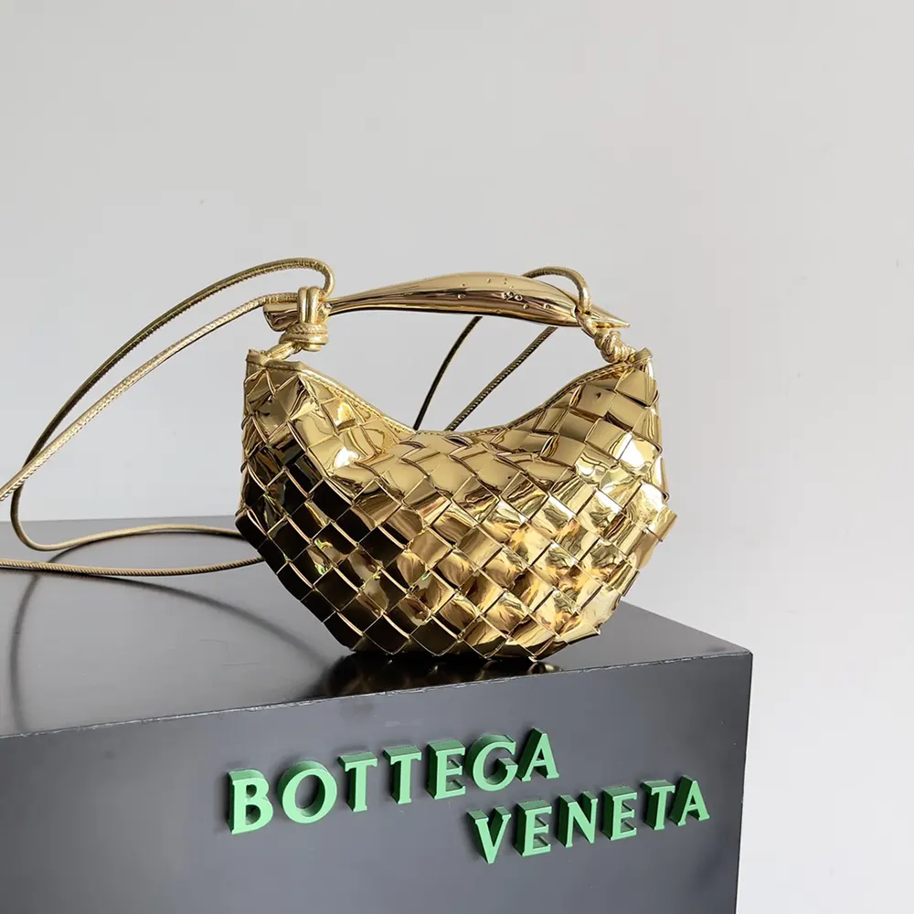 Close-up of gold intrecciato leather texture on Baby Sardine-Gold bag