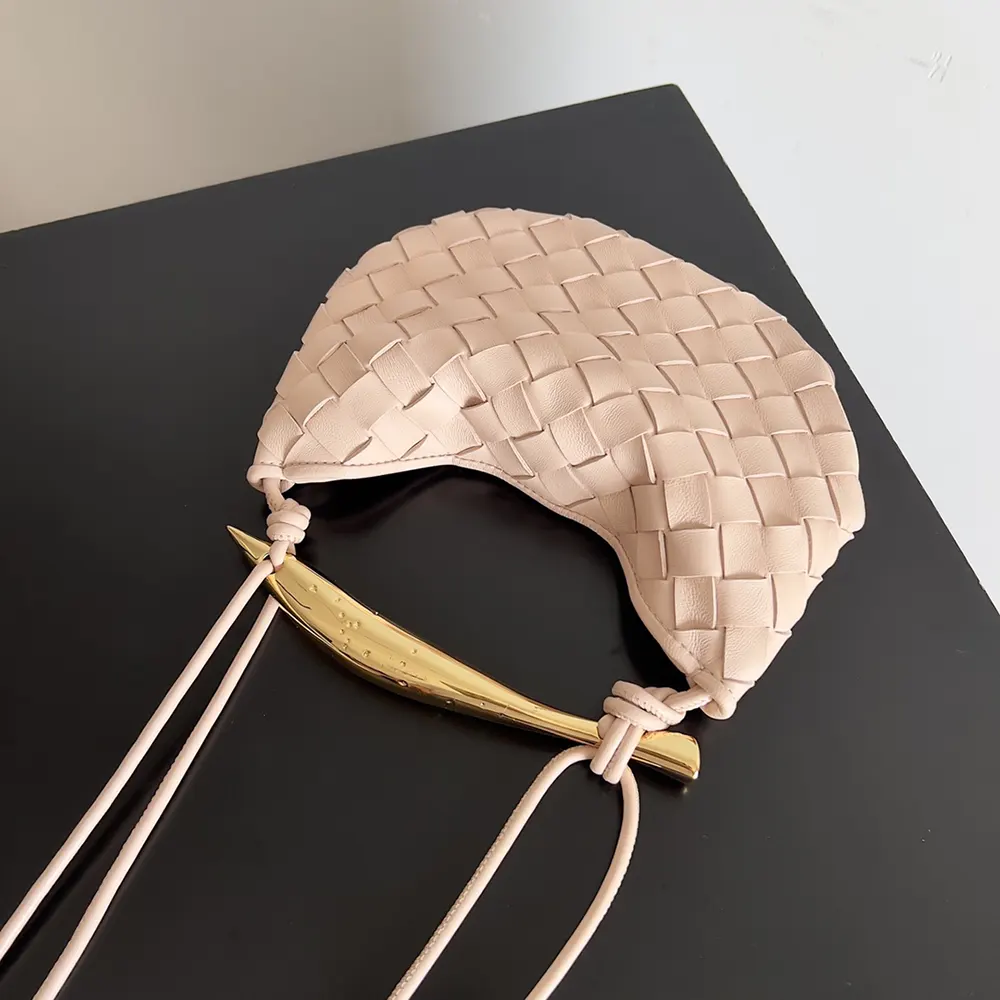 Side angle showing gold hardware on Bottega Veneta Baby Sardine-Pink