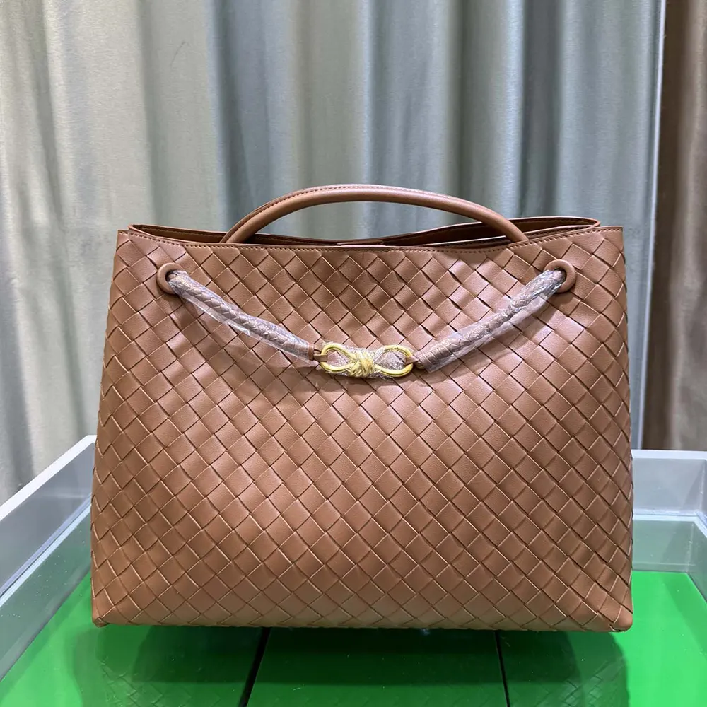 Close-up of brown Intrecciato leather weave on Bottega Veneta Medium Andiamo bag