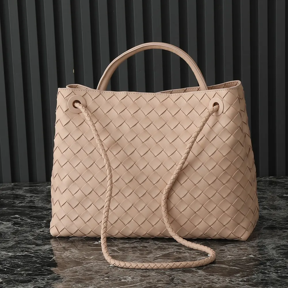 Side angle showing polished gold hardware on Bottega Veneta Women Medium Andiamo bag