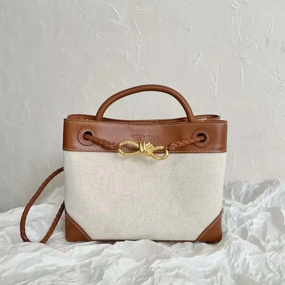 Side profile showing gold-tone hardware on Bottega Veneta Women Small Andiamo bag