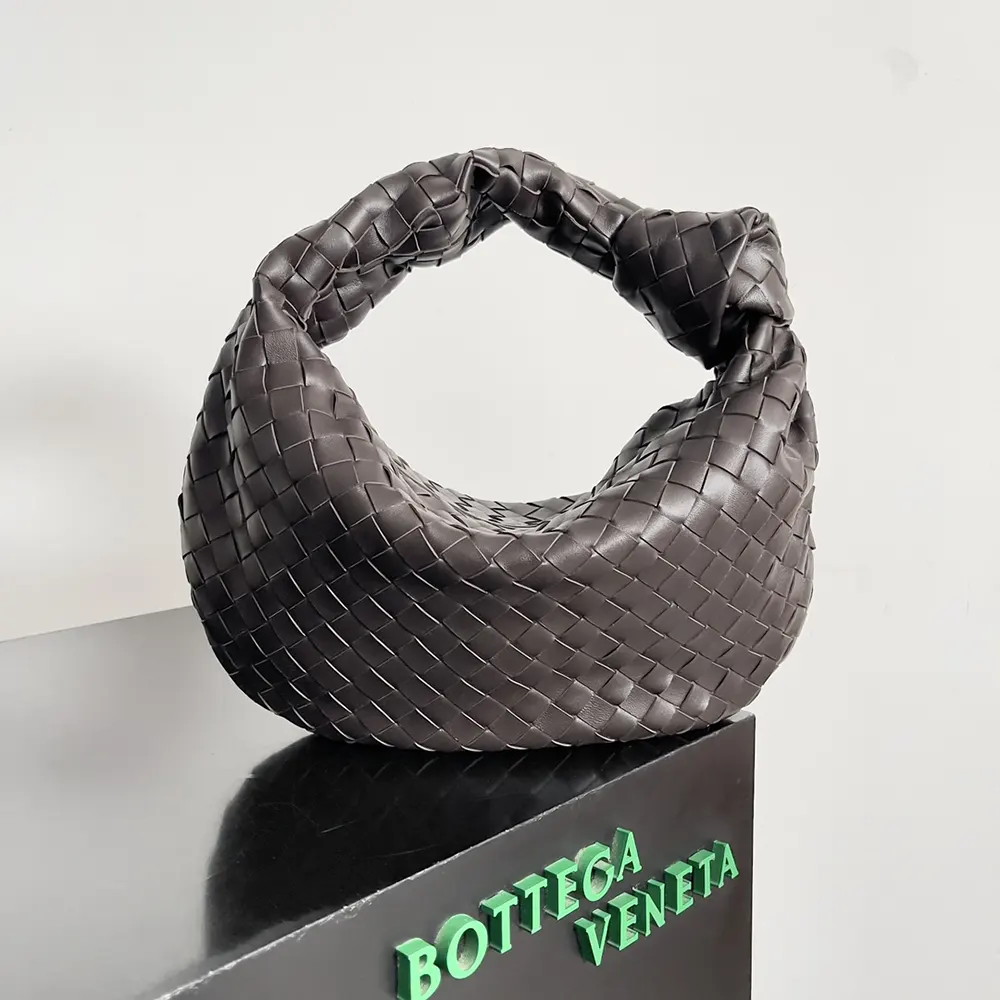Close-up of intrecciato weave and knotted handle detail on Bottega Veneta Women Small Jodie-Chocolate