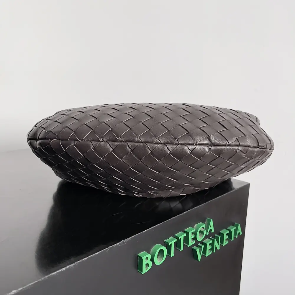 Side angle showing gathered silhouette of Bottega Veneta Women Small Jodie-Chocolate handbag