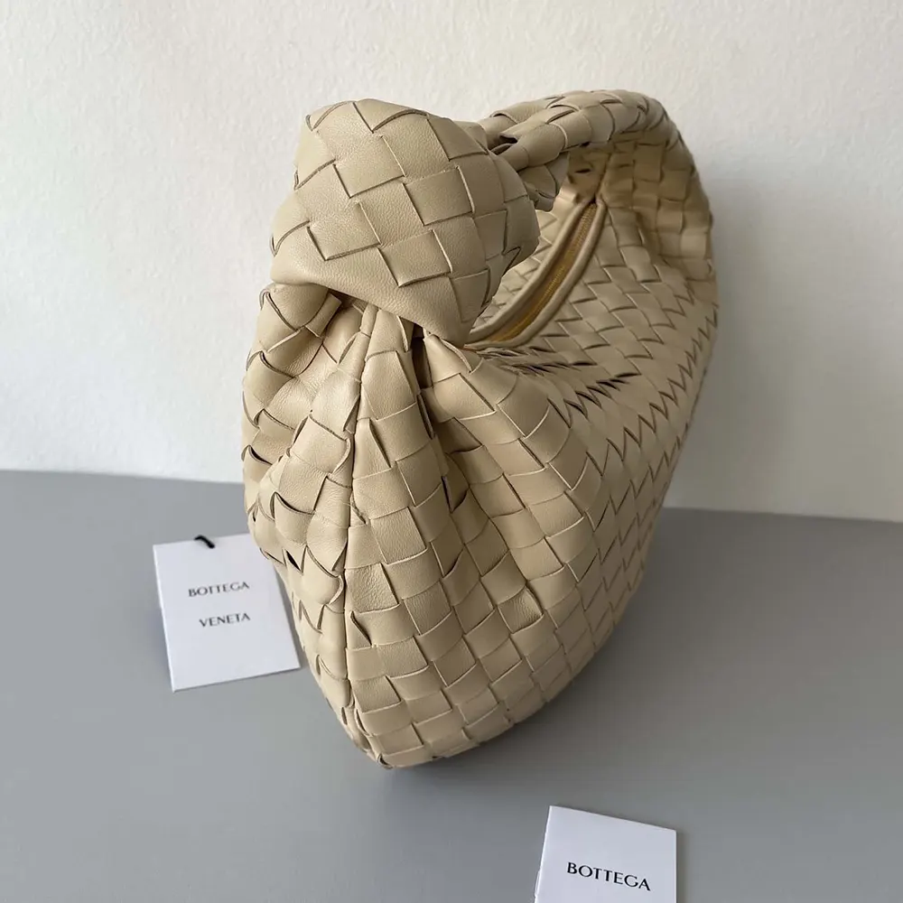 Side profile showing gold hardware on Bottega Veneta Small Jodie-Natural